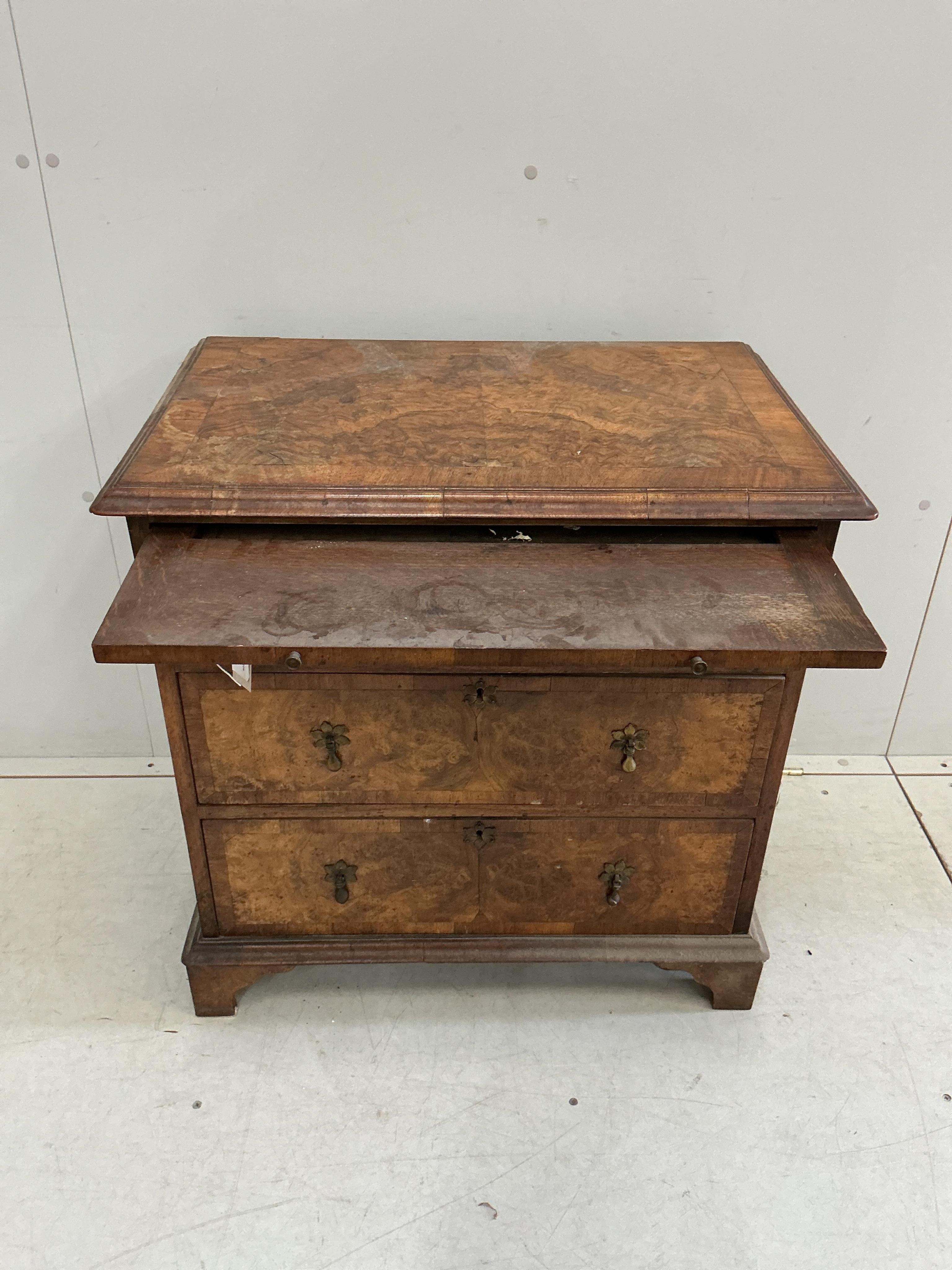 A small Queen Anne Revival crossbanded walnut bachelor’s chest with slide, width 71cm, depth 45cm, height 72cm